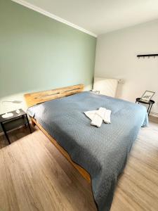 a bedroom with a bed with two towels on it at Utkiek in Fehmarn