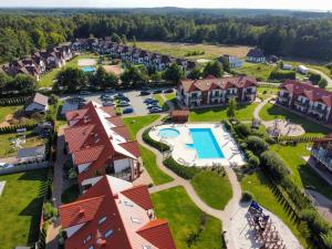 an aerial view of a resort with a swimming pool at Apartament Roberto in Żarnowska