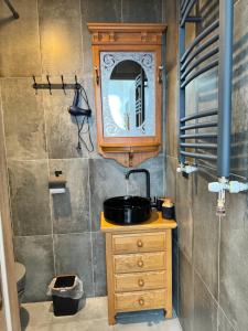 a bathroom with a sink and a mirror at Kesane in Telavi