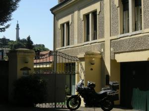 a motorcycle parked in front of a building at Le Residenze dei Serravallo in Trieste