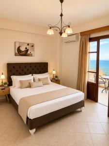 A bed or beds in a room at Sofotel - Refined Comfort, Koroni Centre