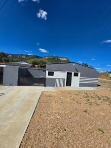 a large building with a garage at Microcasa 6 in Lajeado