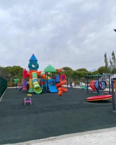 a park with a playground with a slide and slidesktop at Атлантис in Chon-Sary-Oy