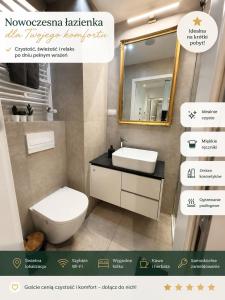a bathroom with a toilet and a sink and a mirror at Poznań Plac Wolności 6 Bond in Poznań +11 photos