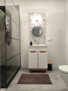 a bathroom with a sink and a mirror at B&B Royal Liberty in Ústí nad Labem