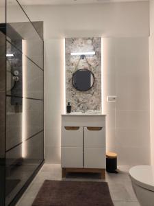 a bathroom with a sink and a mirror at B&B Royal Liberty in Ústí nad Labem