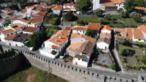 an aerial view of a town behind a wall at Casa do Javali 3 in Bragança