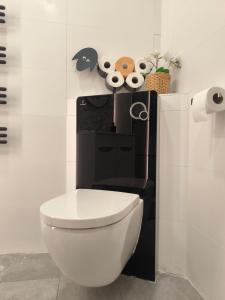 a bathroom with a white toilet in a room at B&B Royal Liberty in Ústí nad Labem
