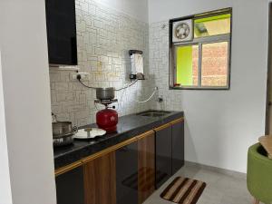 a kitchen with a mixer on a counter at Casa asud Dapoli in Dapoli