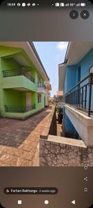 a picture of a building with a balcony and a picture at Casa asud Dapoli in Dapoli