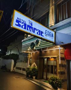 a sign for a hotel gamma eden on a building at Hotel Samrat - A Boutique Hotel in Prayagraj +6 photos