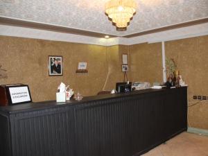a bar in a restaurant with a counter top at Riad Perlamazigh in Zagora +96 photos