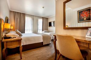 a hotel room with a bed and a desk at The central hotel in Istanbul +30 photos
