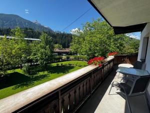 a balcony with a view of a yard at Landhaus Zoppoth in Kötschach