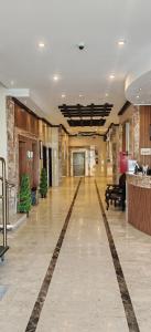 a large lobby with a long hallway with a lobby at المها إن للشقق المخدومة in Hail
