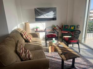 a living room with a couch and a table at Blumar El Sokhna in Ain Sokhna