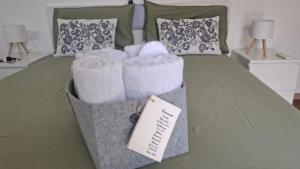 a bedroom with a bed with two bags on it at Bobbio Relax in Bobbio +17 photos