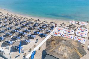 an overhead view of a beach with chairs and umbrellas at Safir Blue Resort in Saturn +52 photos