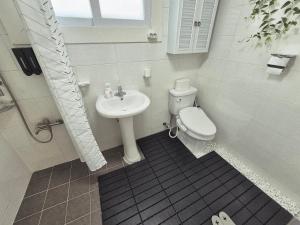 a bathroom with a toilet and a sink at 곁 Stay in Seoul