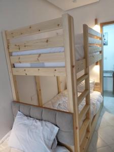 a bunk bed in a room with a bunk bed in a room at Studio cozy 04 in Tangier