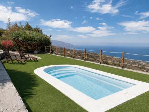a swimming pool with a view of the ocean at Celeste in Mazo
