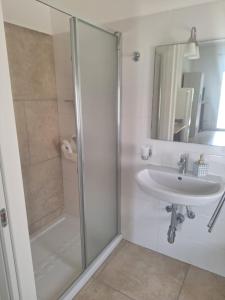 a bathroom with a shower and a sink at Da zia Sofia in Torre Lapillo +43 photos