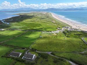 an aerial view of a beach and the ocean at Kittys Haven in Castlemaine