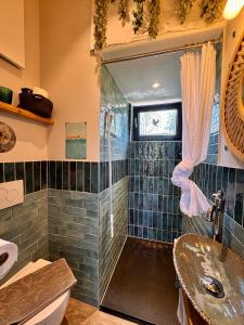 a bathroom with a shower and a sink at Luxus Kutsche in Grafengehaig +40 photos