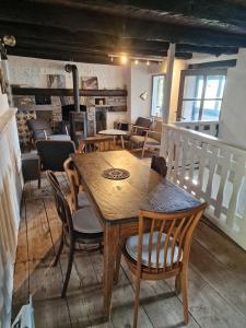 a dining room with a wooden table and chairs at Casa Grande in Falmenta