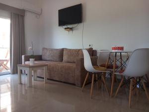 a living room with a couch and a table at Vila Nina Donji Štoj in Ulcinj