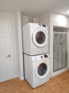 a washing machine and a dryer in a room at Central Light-Filled 3rd Floor -3C in Halifax