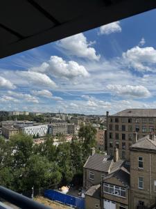 a view of a city from a window at Elysium pro in Bradford
