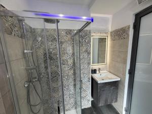 a bathroom with a shower and a sink at Cardinal Rooftop Townhouse by Aureum in Birgu +34 photos
