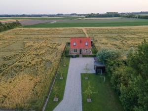 an aerial view of a house in the middle of a field at NIEUW Landzicht in Serooskerke