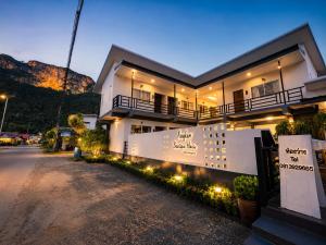 a house with lights on the side of a street at Nangkam Boutique House in Ko Phi