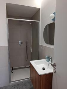 a bathroom with a shower and a sink at Studio64 in Civitavecchia +27 photos
