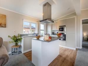 a kitchen with white cabinets and a counter top at Winnal View - Uk46891 in Kinlet