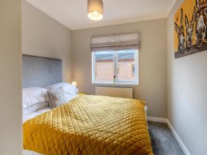 a bedroom with a bed and a window at Winnal View - Uk46891 in Kinlet