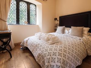 a bedroom with a bed with two towels on it at The Tower - Uk46652 in Crickhowell