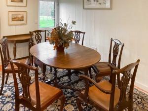 a dining room with a wooden table and chairs at The Library - Uk46649 in Crickhowell
