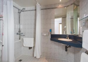 a bathroom with a sink and a shower at Holiday Inn Express Bristol Filton by IHG in Bristol +25 photos