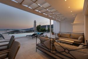 a living room with a couch and a view of the ocean at Villa Yakamoz in Kalkan
