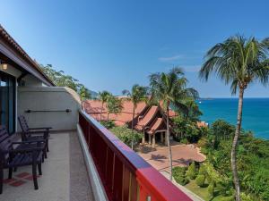 a balcony with chairs and a view of the ocean at Novotel Phuket Resort in Patong Beach +200 photos