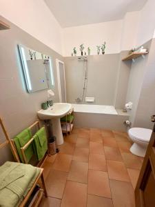 a bathroom with a tub and a sink and a toilet at Porta Del Ricetto in Candelo +21 photos