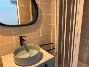 a bathroom with a bowl sink on a counter at Maisonnette in Arès +7 photos
