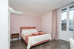 Voodi või voodid majutusasutuse Amendola Rooms toas
