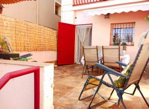 a group of chairs sitting on a patio at EL LLIMONER in Sant Jordi