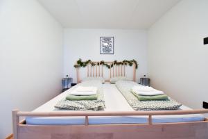 a bedroom with a bed with two pillows at Arktik in Bojnice