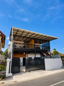 a building with a canopy on top of it at Primera Vacation Home in Luang Prabang