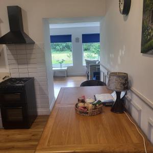 a kitchen with a table with a basket of food on it at Farm Cottage in Athy